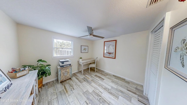 2007 Oak St, Melbourne Beach, FL 32951 - office space featuring a ceiling fan, light wood-style floors, and baseboards