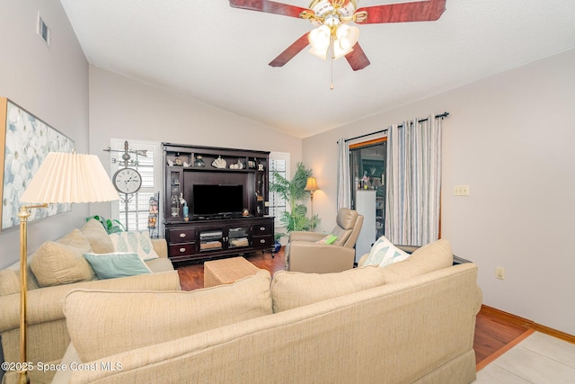 6855 Bryant Rd, Cocoa, FL 32927 - living area featuring lofted ceiling, a ceiling fan, wood finished floors, and baseboards