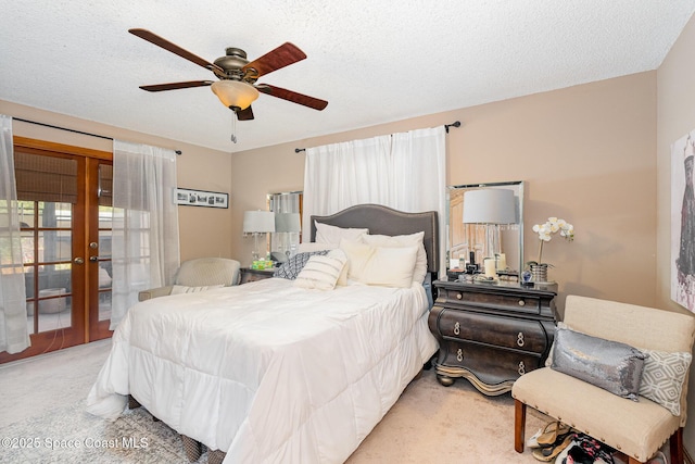 6855 Bryant Rd, Cocoa, FL 32927 - bedroom with french doors, light colored carpet, a ceiling fan, and a textured ceiling