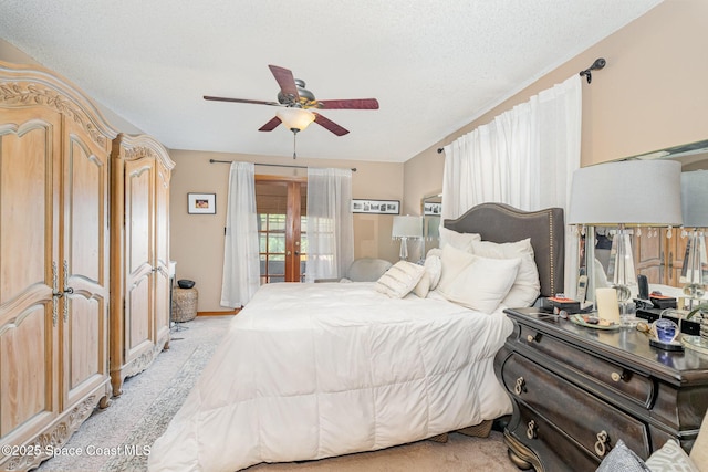 6855 Bryant Rd, Cocoa, FL 32927 - bedroom featuring light colored carpet, a ceiling fan, baseboards, a textured ceiling, and access to outside