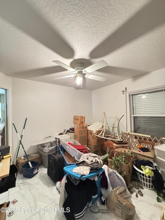 1112 Pine Creek Cir NE, Palm Bay, FL 32905 - misc room with a ceiling fan, a textured ceiling, and light marble finish floors