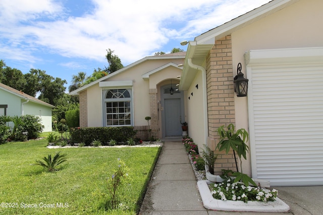 1112 Pine Creek Cir NE, Palm Bay, FL 32905 - entrance to property featuring brick siding and a lawn