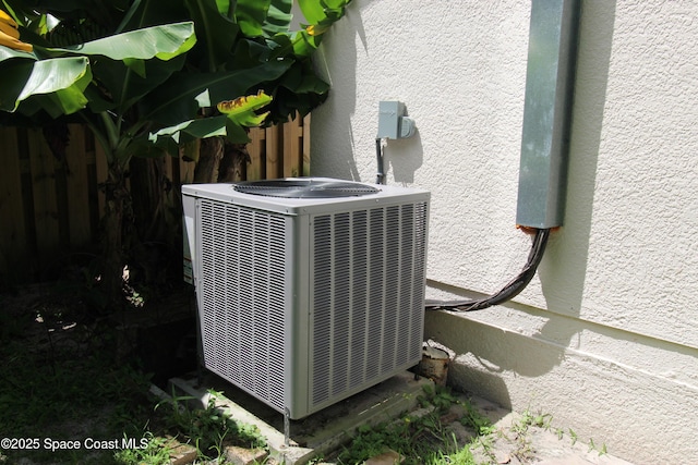 1112 Pine Creek Cir NE, Palm Bay, FL 32905 - exterior view of central AC unit and stucco siding