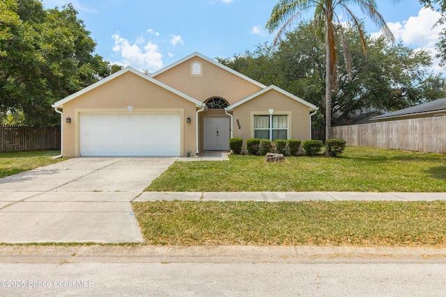 854 Belhurst Ln, Rockledge, FL 32955 - view of front of home featuring an attached garage, driveway, and stucco siding