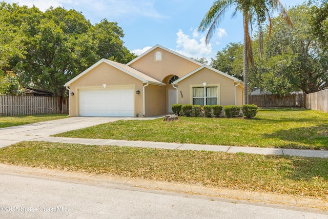 854 Belhurst Ln, Rockledge, FL 32955 - view of front facade featuring a garage, concrete driveway, and stucco siding