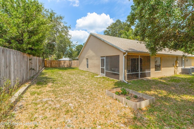 854 Belhurst Ln, Rockledge, FL 32955 - view of yard with cooling unit, a sunroom, and a garden