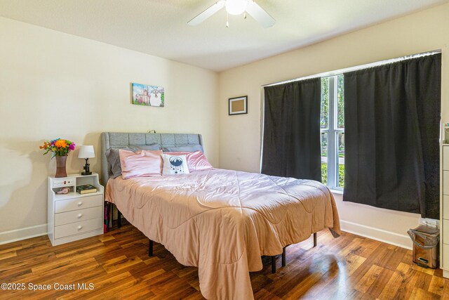 854 Belhurst Ln, Rockledge, FL 32955 - bedroom featuring wood finished floors, baseboards, and ceiling fan