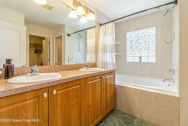 854 Belhurst Ln, Rockledge, FL 32955 - bathroom with tiled shower / bath and double vanity