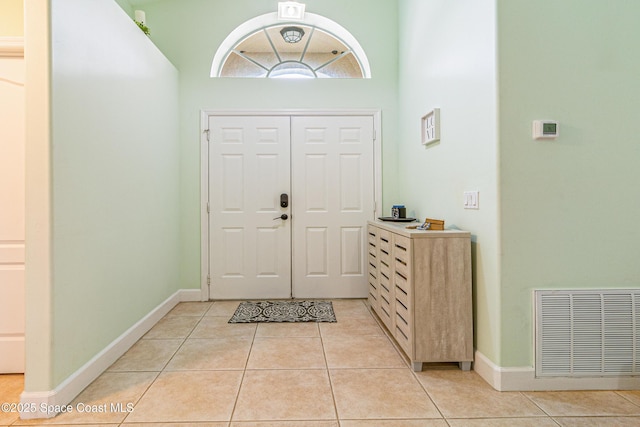 854 Belhurst Ln, Rockledge, FL 32955 - foyer entrance with light tile patterned floors and baseboards