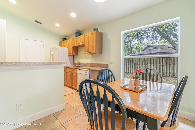 854 Belhurst Ln, Rockledge, FL 32955 - dining space with light tile patterned floors, recessed lighting, baseboards, and lofted ceiling