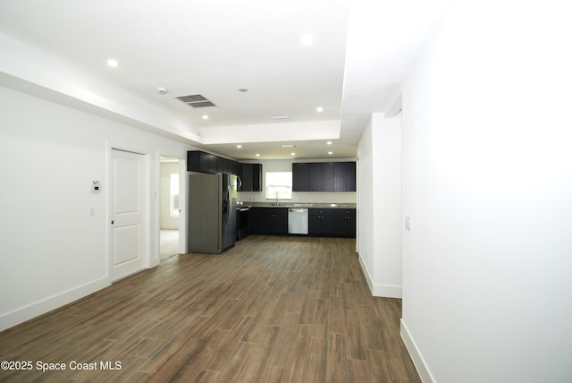 1558 Pentax Ave, Titusville, FL 32796 - kitchen featuring stainless steel appliances, dark wood-style floors, light countertops, recessed lighting, and baseboards