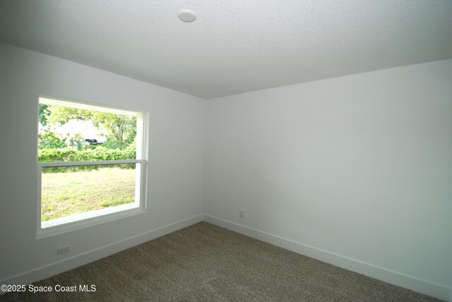 1558 Pentax Ave, Titusville, FL 32796 - unfurnished room featuring carpet and baseboards