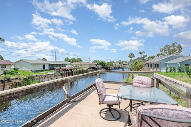 6519 June Dr, Cocoa, FL 32926 - dock featuring a water view, a residential view, and outdoor dining space