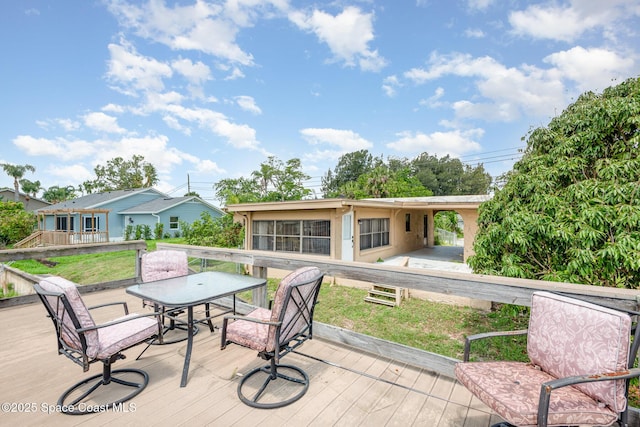 6519 June Dr, Cocoa, FL 32926 - wooden terrace with outdoor dining space