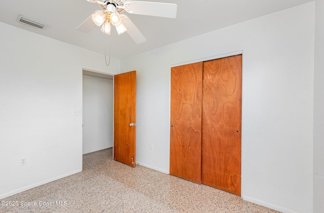 6519 June Dr, Cocoa, FL 32926 - unfurnished bedroom with speckled floor, a closet, and baseboards