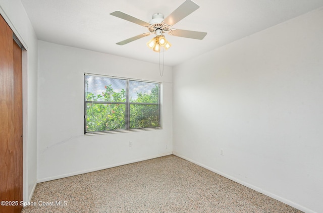6519 June Dr, Cocoa, FL 32926 - unfurnished room with baseboards, speckled floor, and a ceiling fan