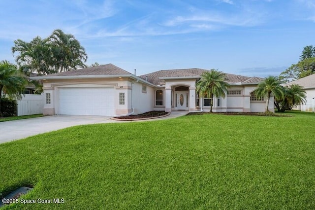 4178 Ventana Blvd, Rockledge, FL 32955 - view of front of home featuring concrete driveway, a garage, and stucco siding