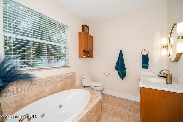 4178 Ventana Blvd, Rockledge, FL 32955 - bathroom with a tub with jets, vanity, toilet, tile patterned floors, and baseboards