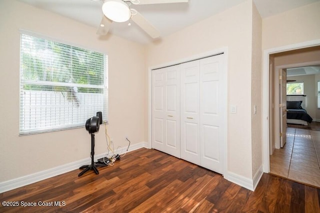 4178 Ventana Blvd, Rockledge, FL 32955 - unfurnished bedroom featuring multiple windows, dark wood finished floors, and a closet