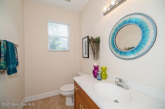 4178 Ventana Blvd, Rockledge, FL 32955 - bathroom featuring vanity, toilet, tile patterned floors, and baseboards