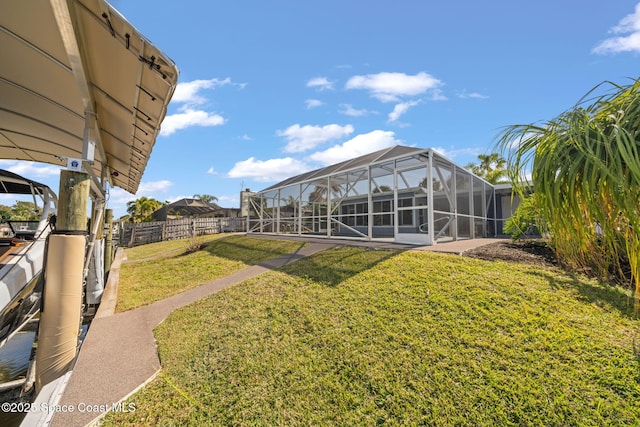 view of yard featuring glass enclosure