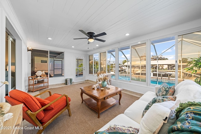 sunroom / solarium with an outdoor living space and ceiling fan