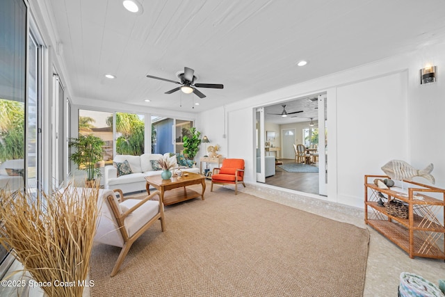 living area featuring a ceiling fan and recessed lighting