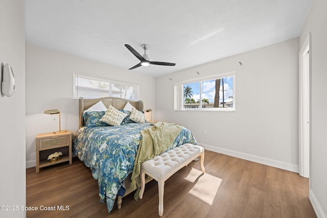 bedroom featuring wood finished floors, baseboards, and ceiling fan