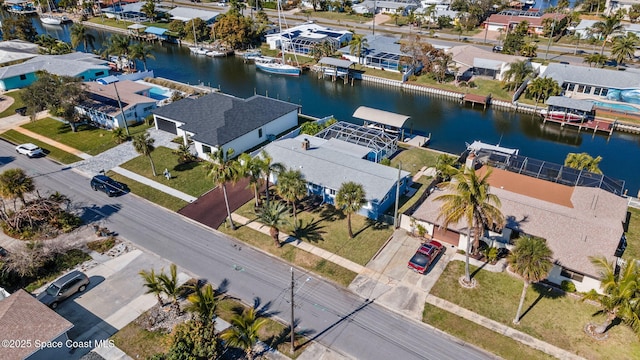 aerial perspective of suburban area with a large body of water