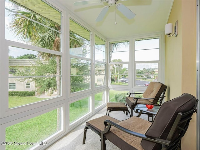 sunroom / solarium with ceiling fan and plenty of natural light
