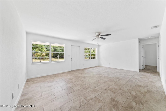 133 Lee Rd, Melbourne, FL 32904 - unfurnished living room with ceiling fan and baseboards