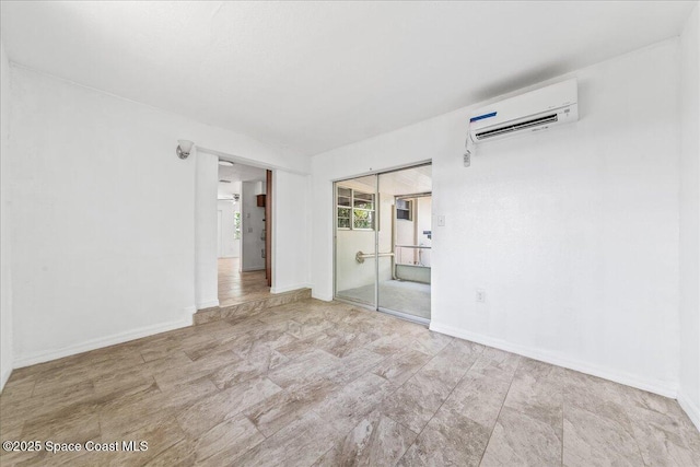 133 Lee Rd, Melbourne, FL 32904 - unfurnished room featuring a wall mounted air conditioner and baseboards