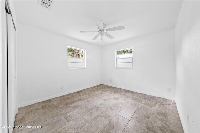 133 Lee Rd, Melbourne, FL 32904 - unfurnished room with healthy amount of natural light, ceiling fan, and baseboards