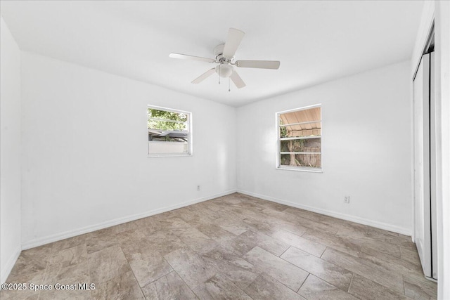 133 Lee Rd, Melbourne, FL 32904 - spare room featuring baseboards and a ceiling fan