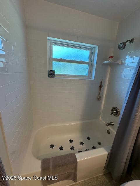 full bath featuring  shower combination