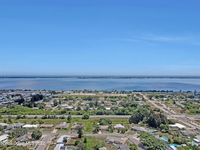 aerial perspective of suburban area featuring a nearby body of water