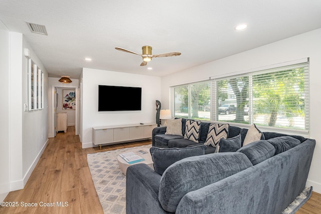 8103 Magnolia Ave, Cape Canaveral, FL 32920 - living area with a ceiling fan, light wood-style flooring, recessed lighting, and baseboards