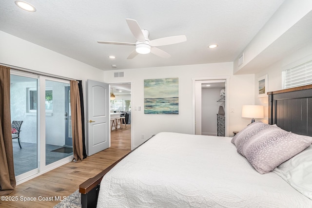 8103 Magnolia Ave, Cape Canaveral, FL 32920 - bedroom featuring wood finished floors, access to outside, recessed lighting, and a ceiling fan