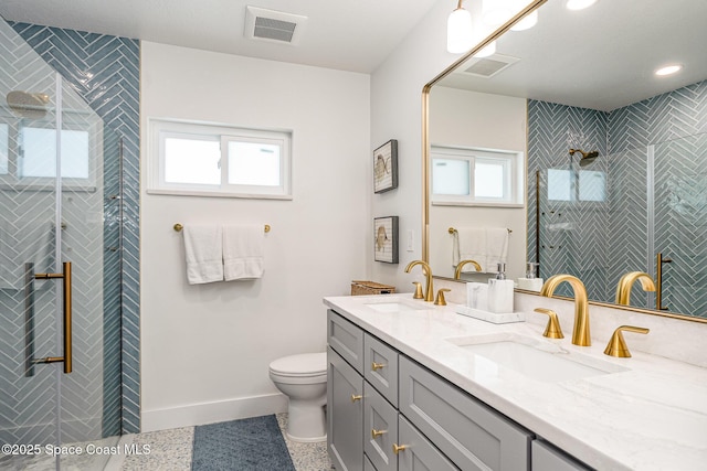 8103 Magnolia Ave, Cape Canaveral, FL 32920 - full bathroom featuring plenty of natural light, a tile shower, baseboards, and double vanity