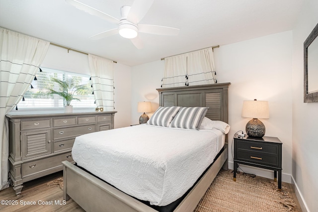 8103 Magnolia Ave, Cape Canaveral, FL 32920 - bedroom featuring light wood finished floors, baseboards, and ceiling fan
