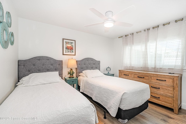 8103 Magnolia Ave, Cape Canaveral, FL 32920 - bedroom featuring light wood finished floors and a ceiling fan