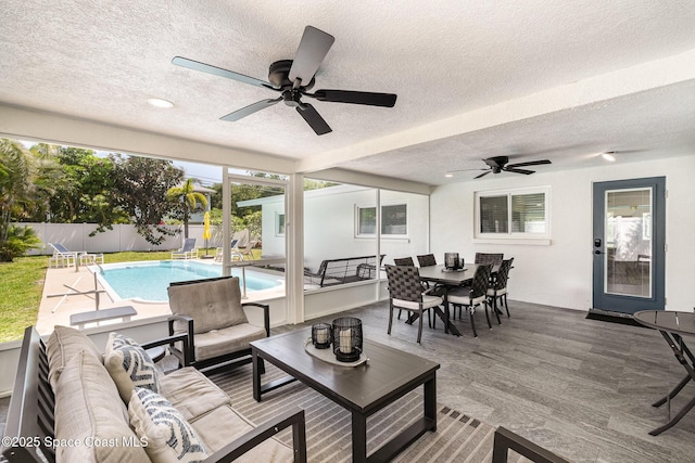 8103 Magnolia Ave, Cape Canaveral, FL 32920 - fenced backyard featuring a ceiling fan, an outdoor hangout area, and outdoor dining space