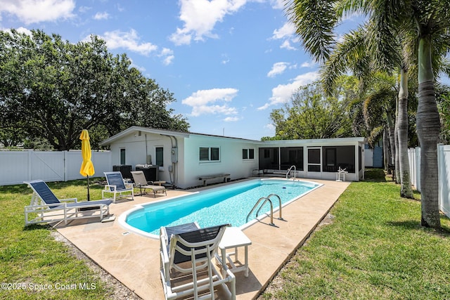 8103 Magnolia Ave, Cape Canaveral, FL 32920 - view of swimming pool with a sunroom and a patio area