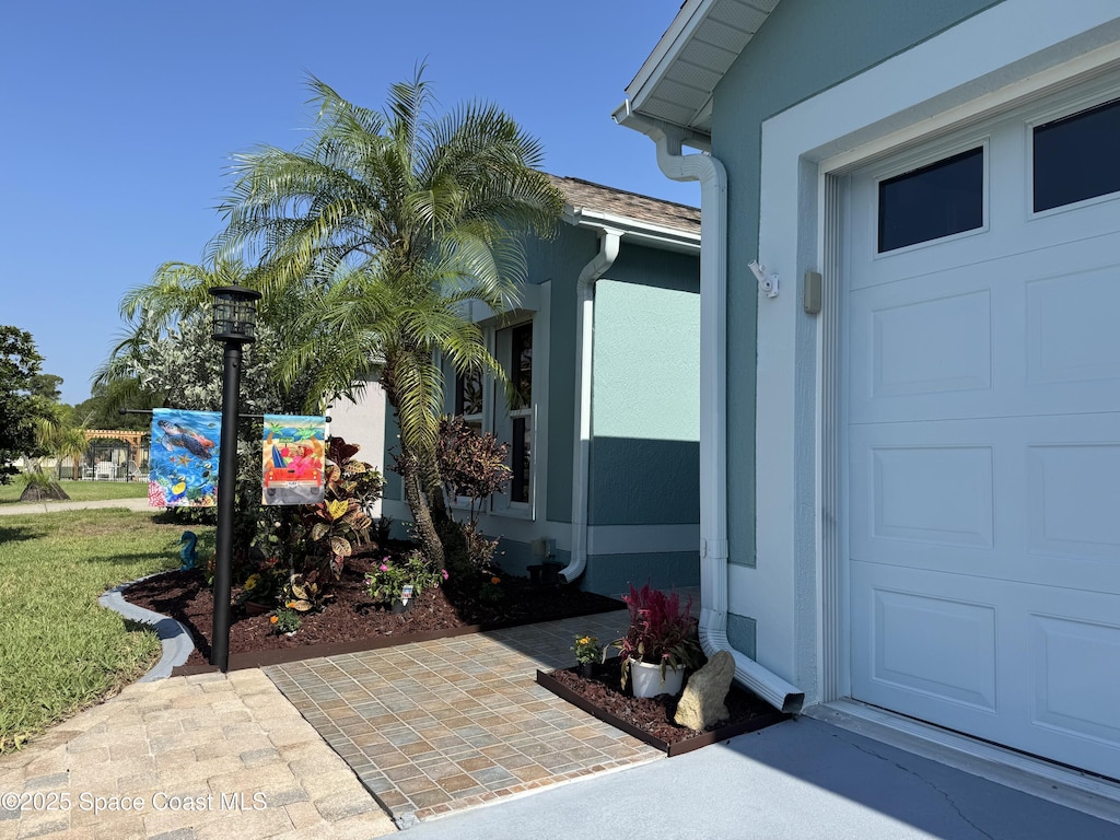 1775 Vista Lake Cir, Melbourne, FL 32904 - view of exterior entry featuring stucco siding