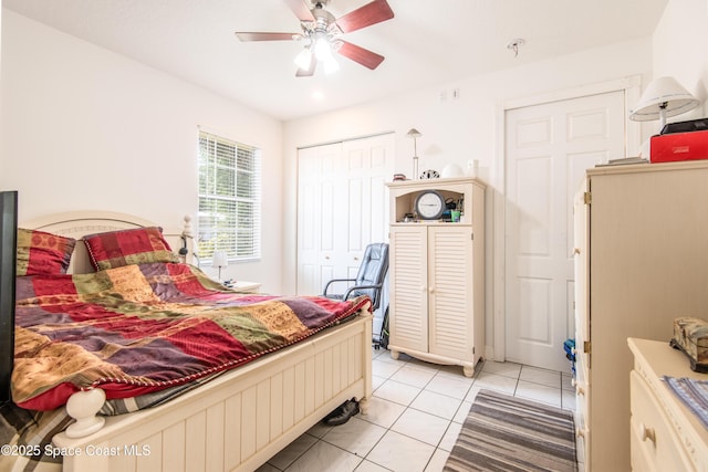 7030 Livingstone Ln, Melbourne, FL 32904 - bedroom featuring a closet, light tile patterned floors, and a ceiling fan