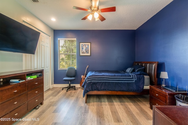 7030 Livingstone Ln, Melbourne, FL 32904 - bedroom with light wood-style floors, baseboards, and a ceiling fan