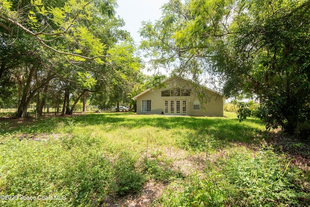 7030 Livingstone Ln, Melbourne, FL 32904 - view of yard with french doors