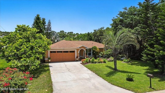 965 19th St SW, Vero Beach, FL 32962 - ranch-style house featuring an attached garage, a front lawn, concrete driveway, and stucco siding