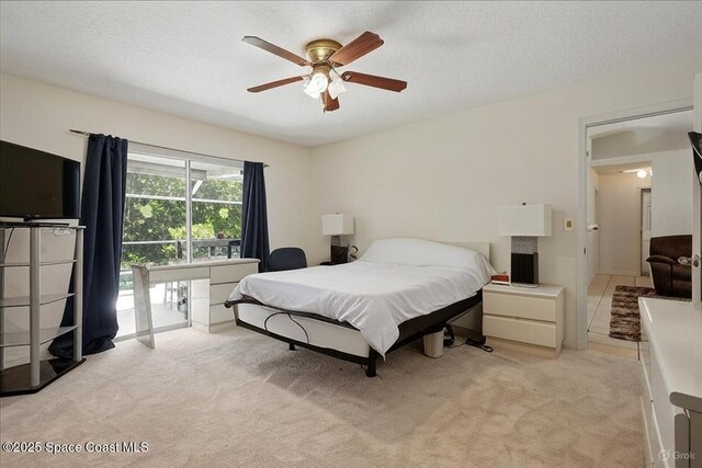 965 19th St SW, Vero Beach, FL 32962 - bedroom featuring light colored carpet, a textured ceiling, and a ceiling fan