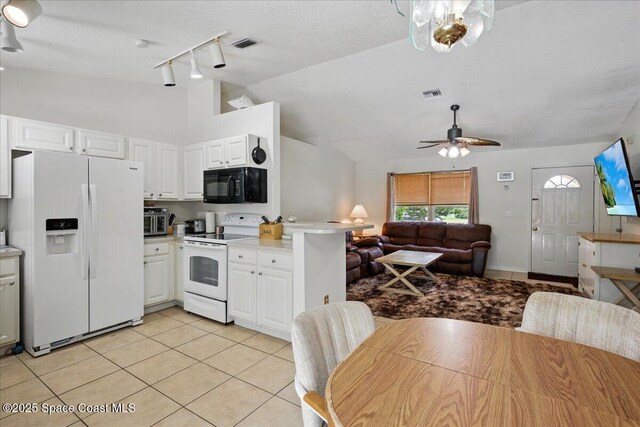 965 19th St SW, Vero Beach, FL 32962 - kitchen featuring white appliances, open floor plan, rail lighting, light tile patterned floors, and ceiling fan